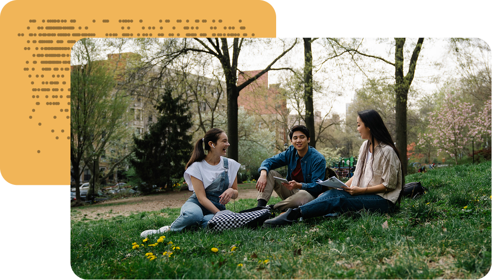 Students spending time together on a campus lawn