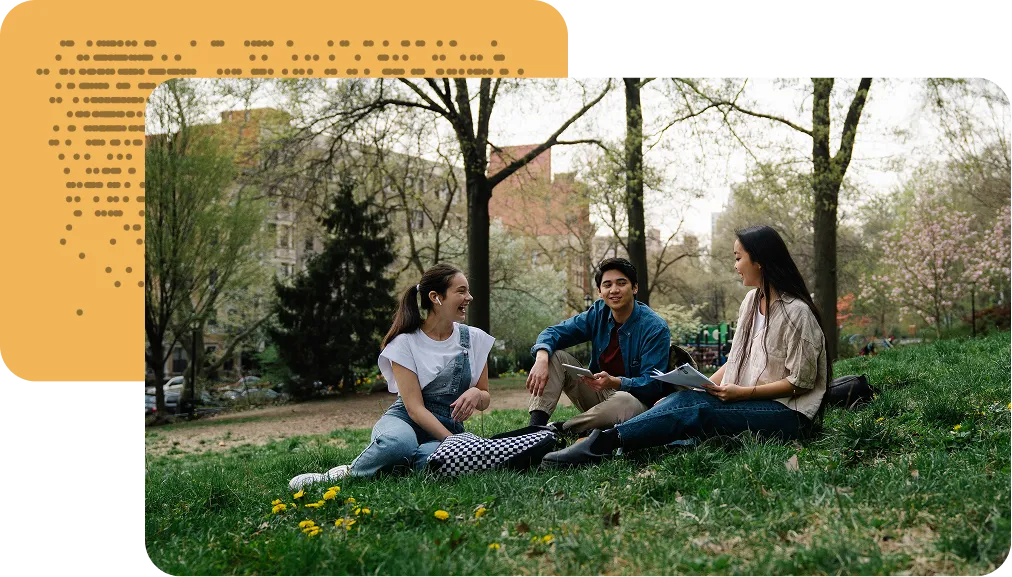 Students spending time together on a campus lawn