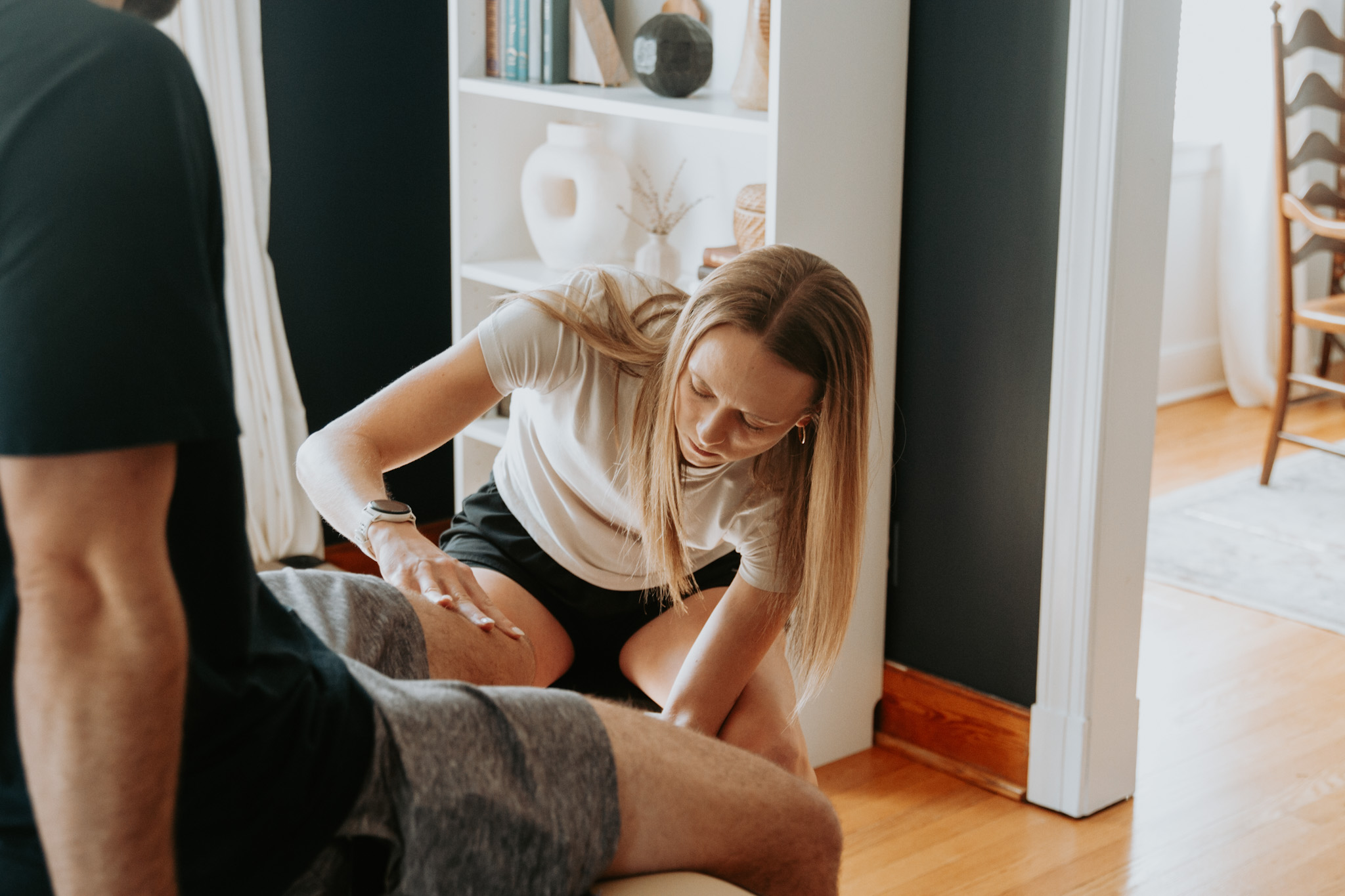 Alyssa treating a patient at home