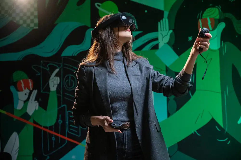 a woman in a vr headset reaching out with controllers