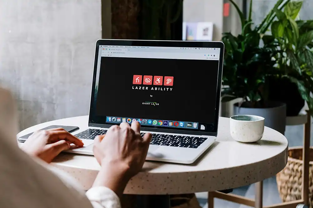 Someone using a laptop in an office setting