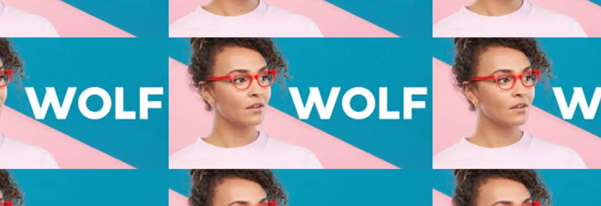 Woman with curly hair wearing red glasses looking to the side against a pink and blue background with the word WOLF.