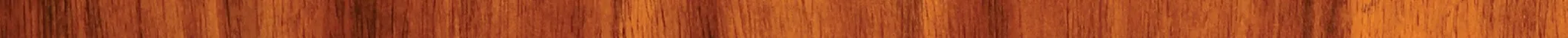 Close-up of polished wooden surface showing natural grain and texture in warm brown tones.