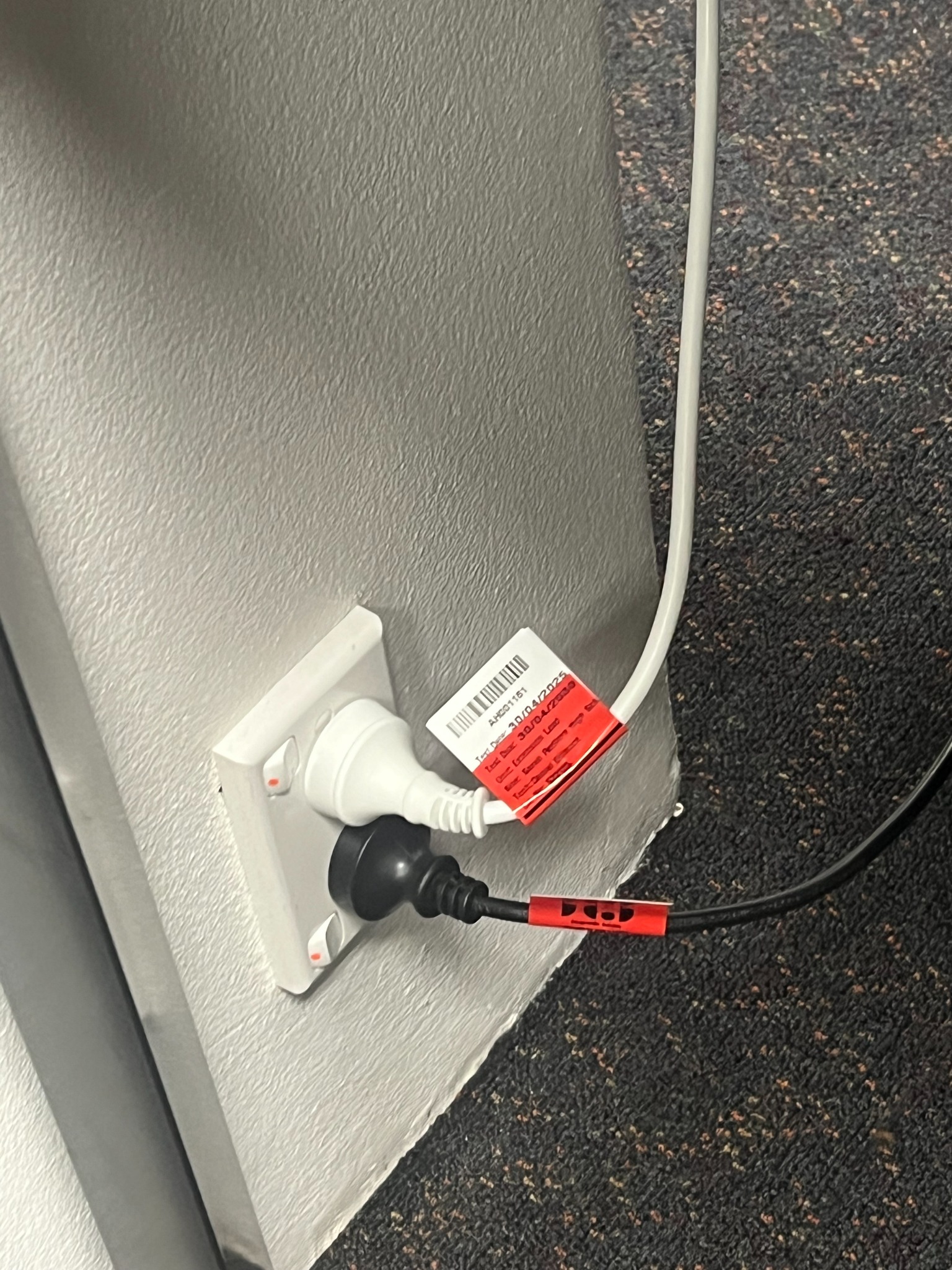 An individually identified extension lead with a test label.