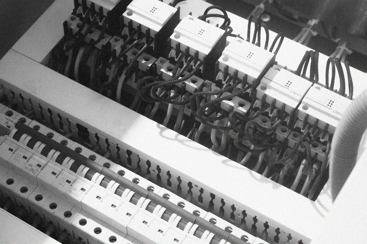 Commercial electrician completing electrical testing and inspection
