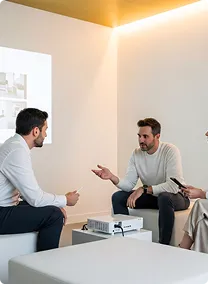 Launchist team discussing with a client in a meeting