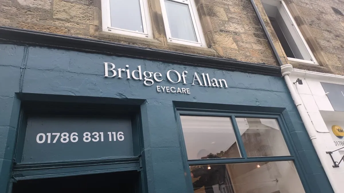 Facade of Bridge Of Allan Eyecare with phone number 01786 831 116 displayed above the entrance.