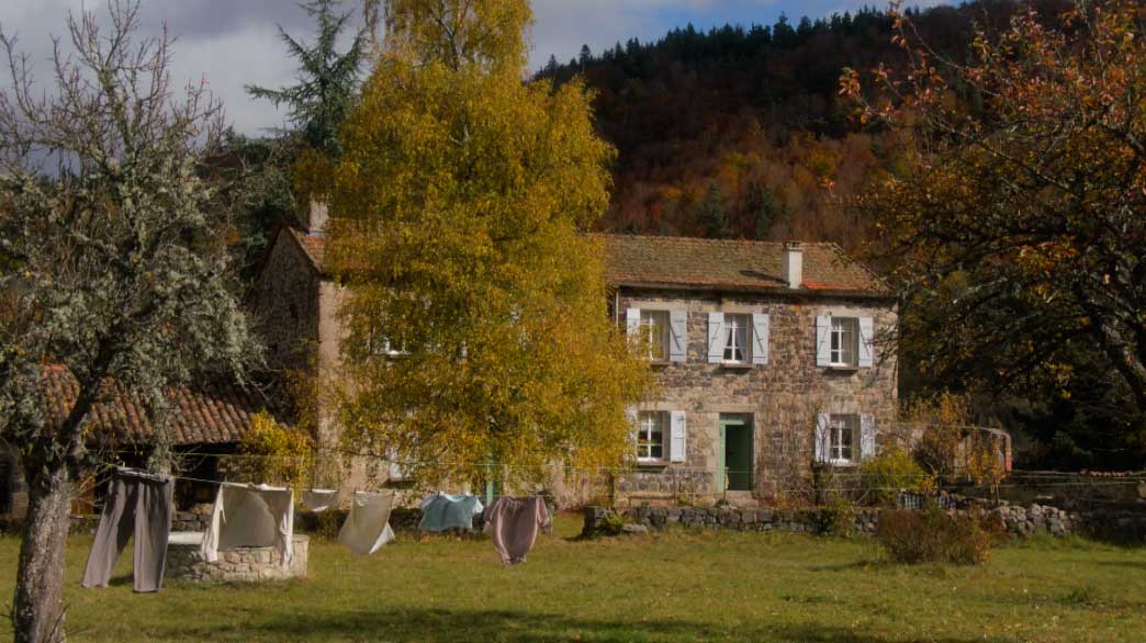 A house in front of hills.