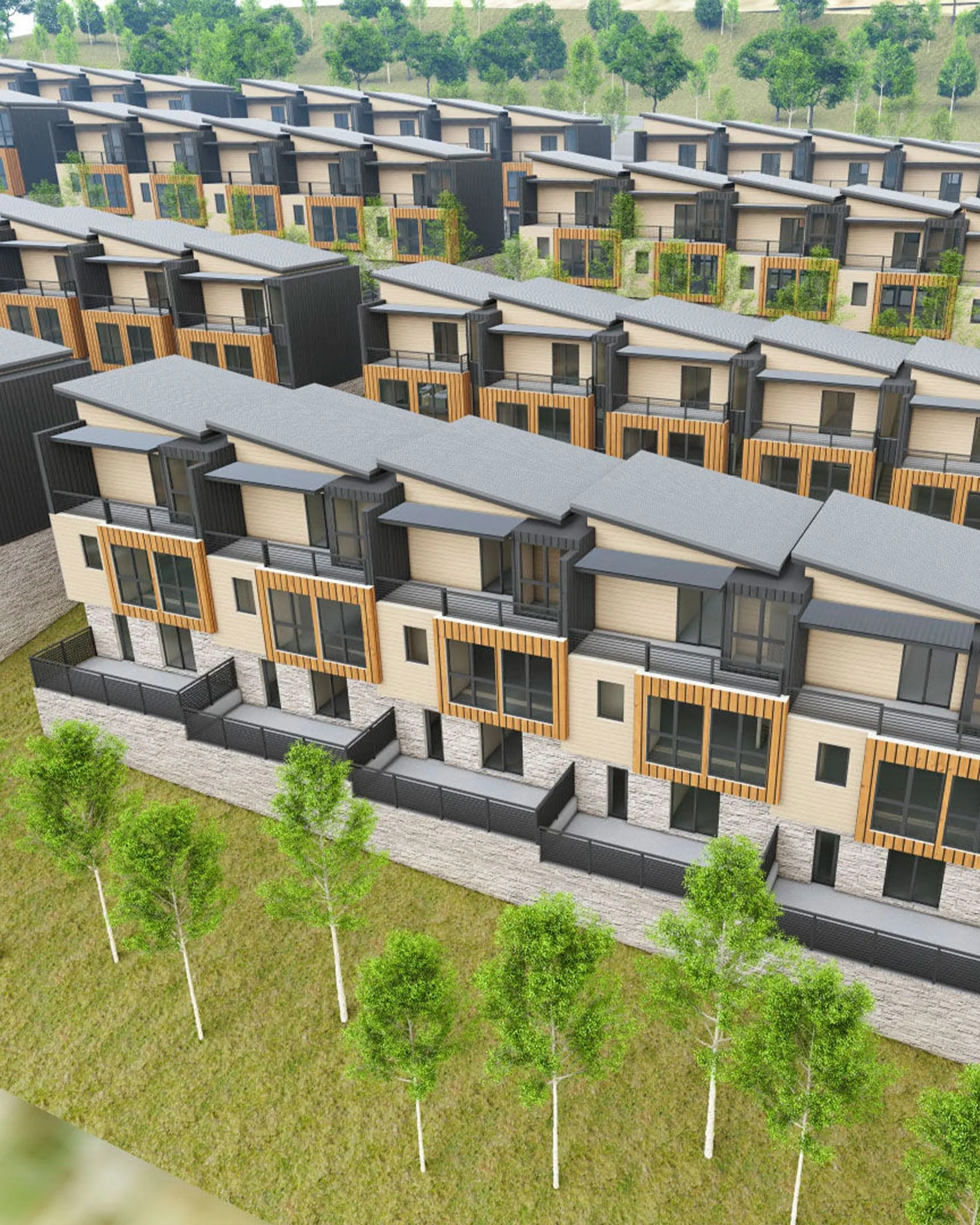 Rows of modern multi-story townhouses with wood and stone facades surrounded by grass and trees.