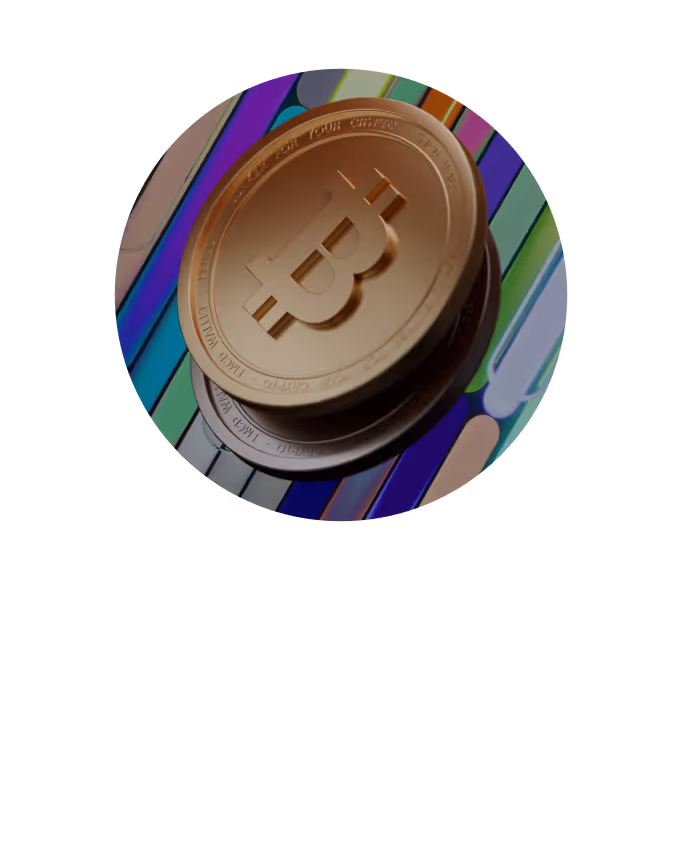 Two metallic Bitcoin coins stacked on a surface with colorful abstract patterns.