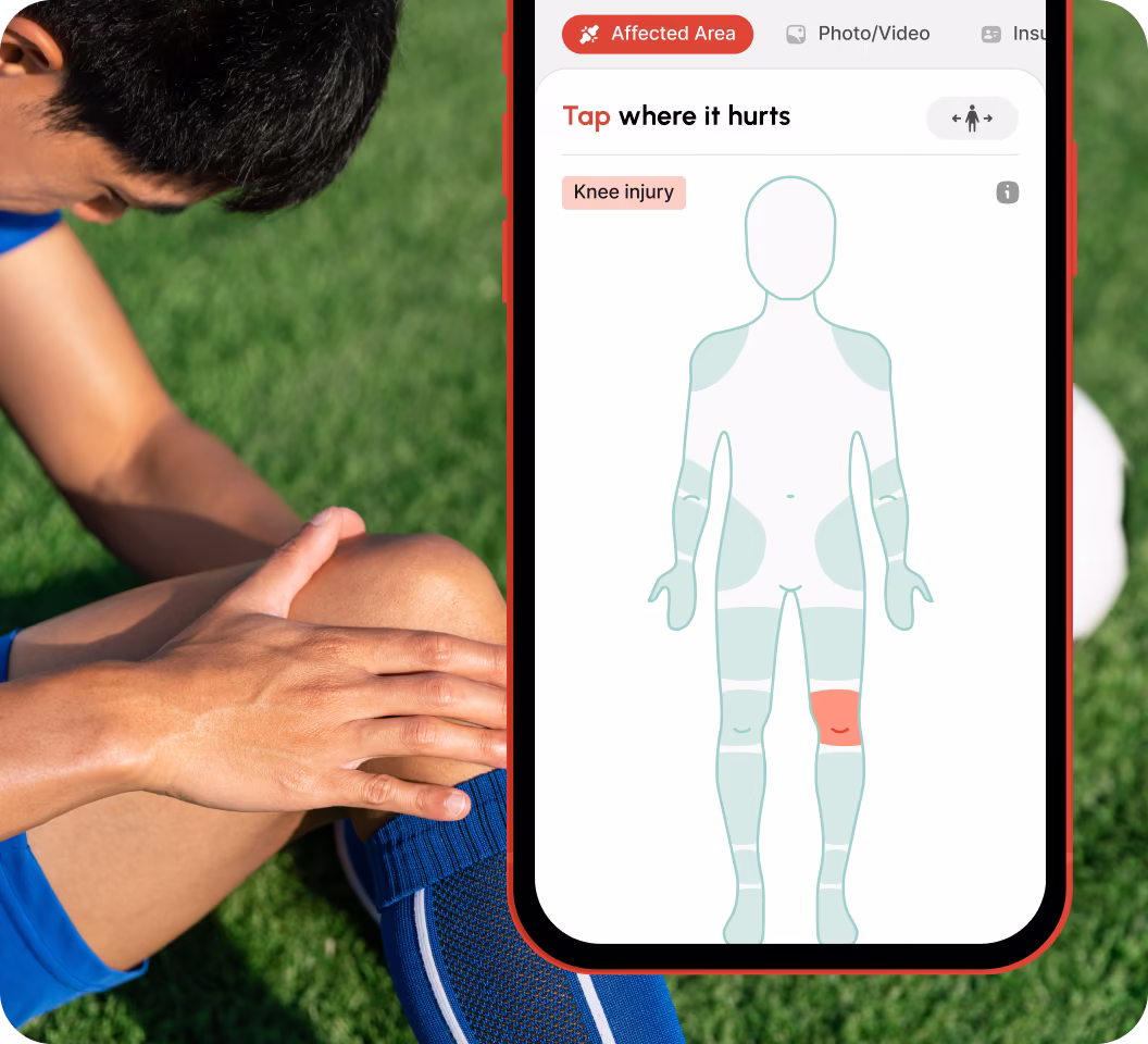Person in blue sportswear holding painful knee on grass next to phone screen showing app highlighting a knee injury.