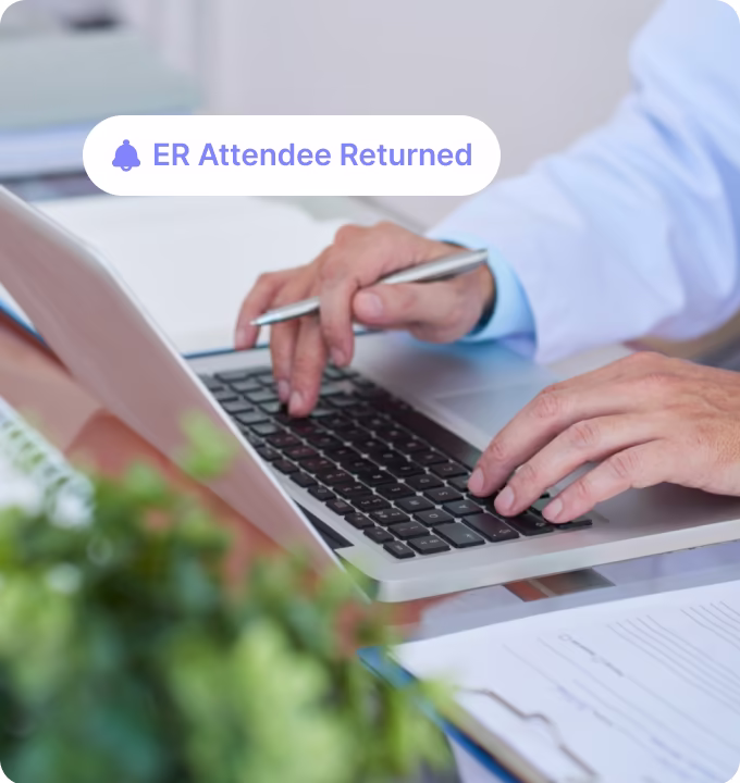 Hands of a person in a white shirt typing on a laptop keyboard with a notification that reads ER Attendee Returned and text saying For Employers with placeholder text.