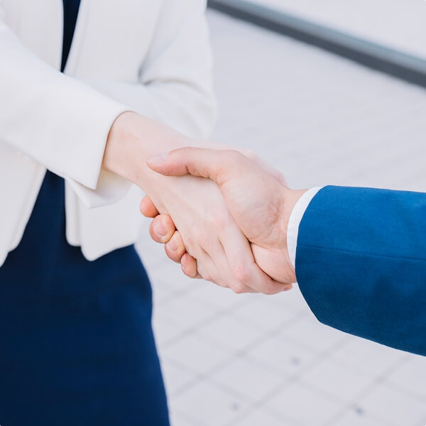 Business handshake representing partnership or agreement