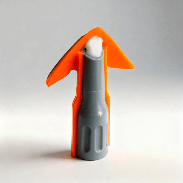 Orange REGGA nozzle with a residue of silicone at the tip.