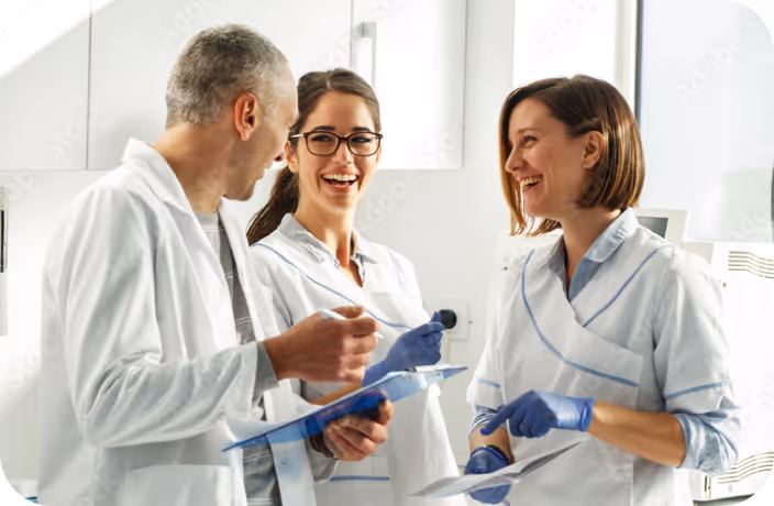 A group of people in white lab coats.