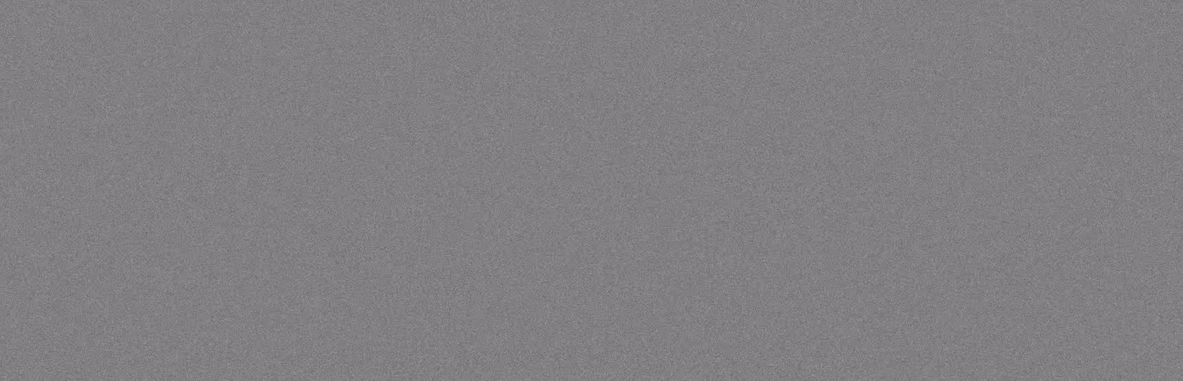 Gray concrete or stone texture with a rough, grainy surface pattern.