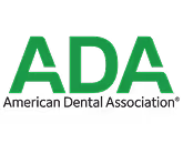 Green letters ADA with black text American Dental Association below.