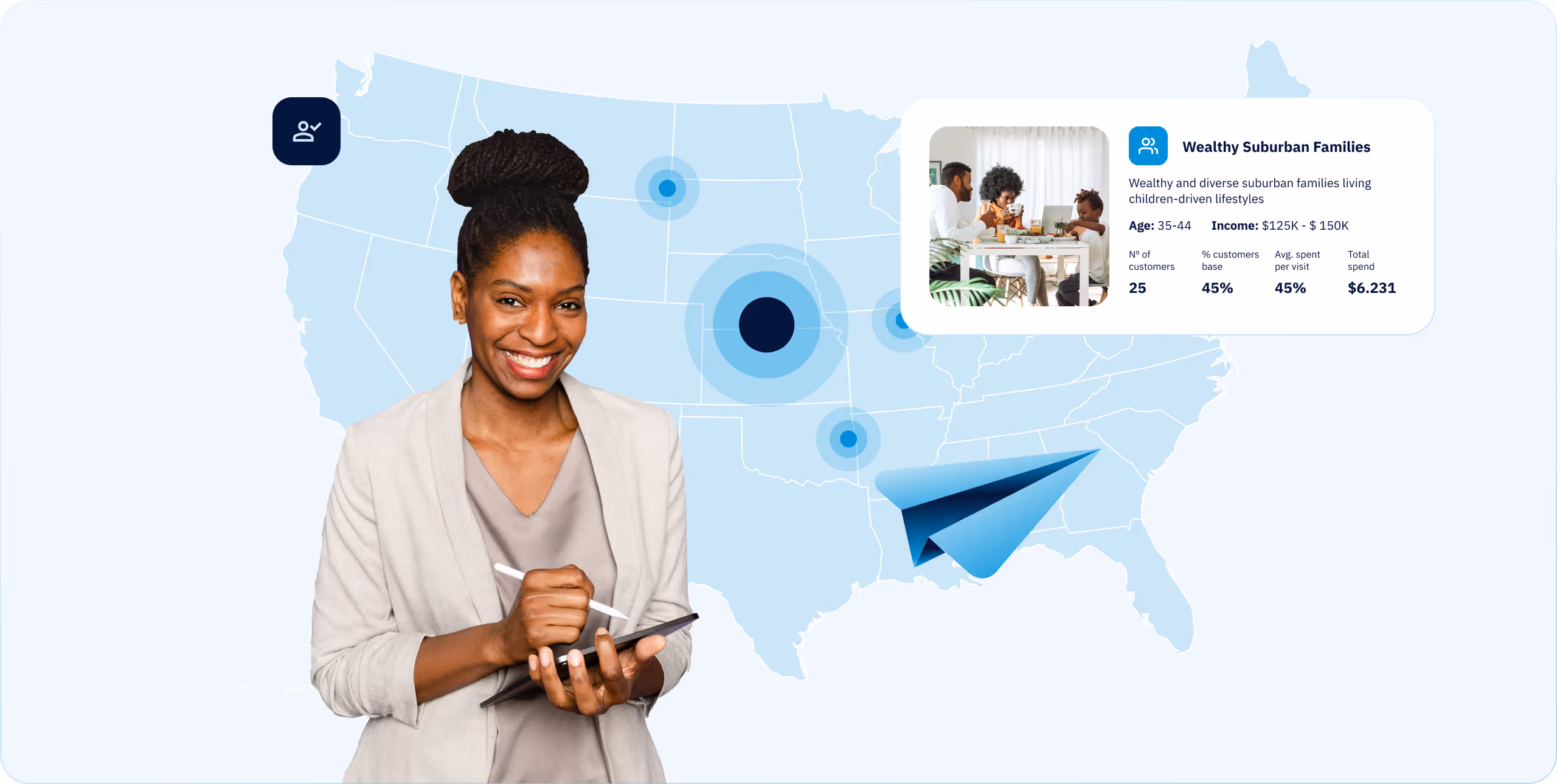Smiling woman with tablet in front of US map highlighting wealthy suburban families data and locations.