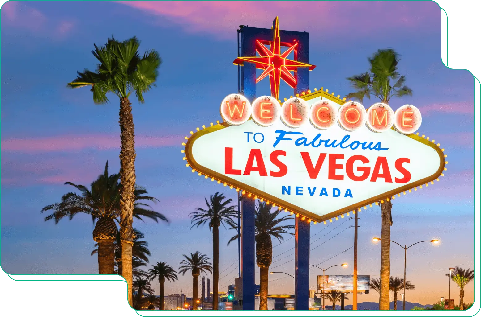 Las Vegas sign against a sunset sky
