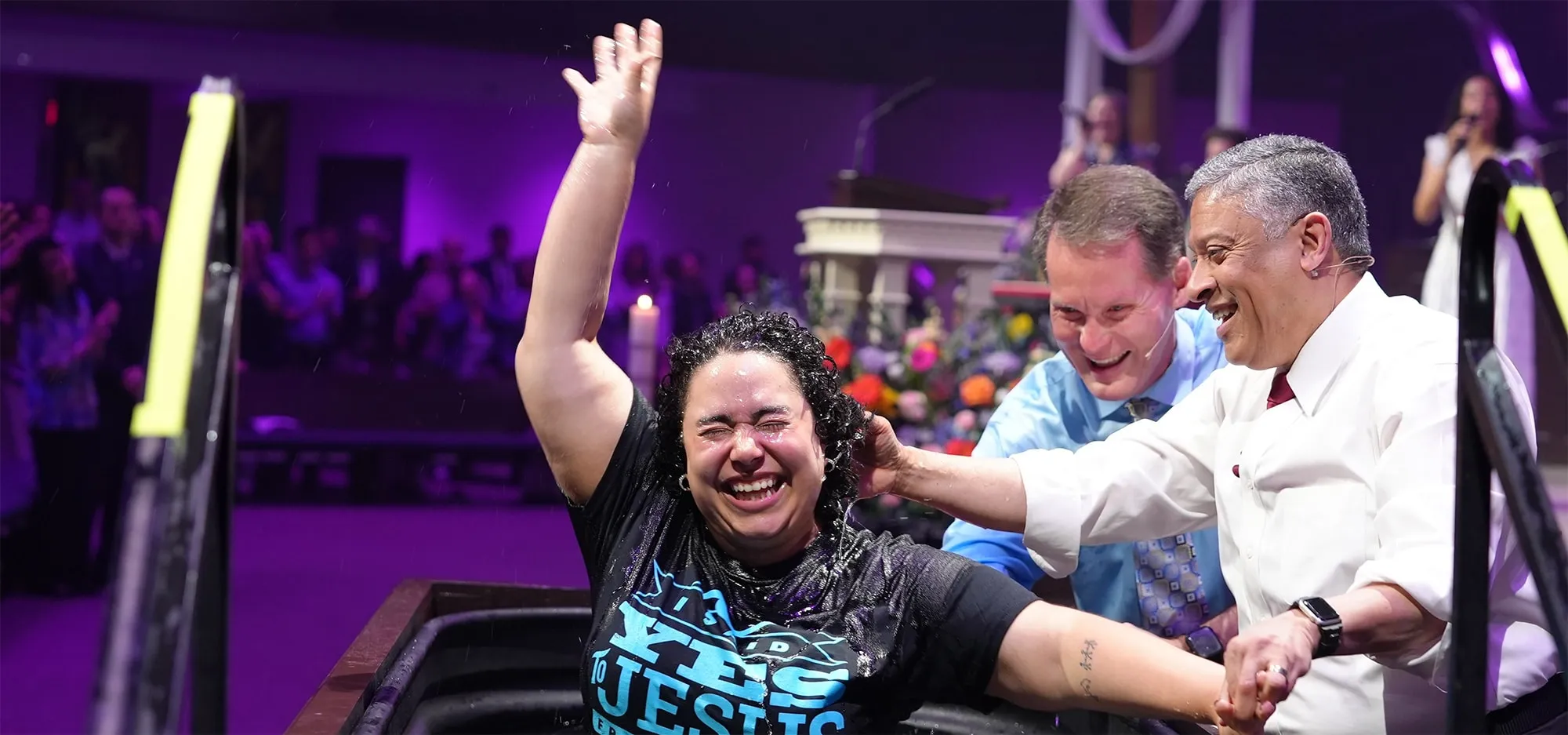Women smiling after getting baptized.