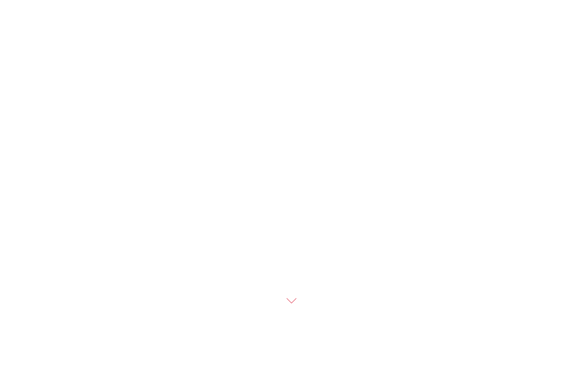 Small pink downward arrow icon on a black background.