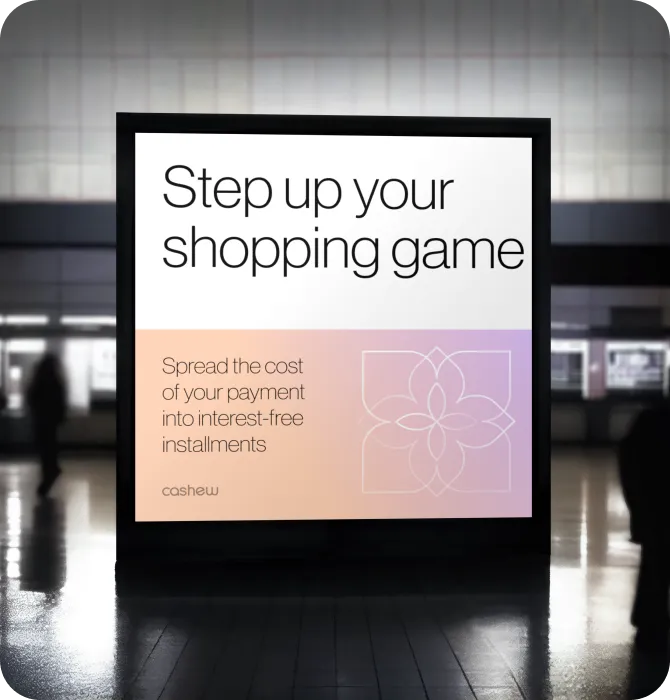 Advertisement sign in a public space with the text: Step up your shopping game. Spread the cost of your payment into interest-free installments, branded Cashew.