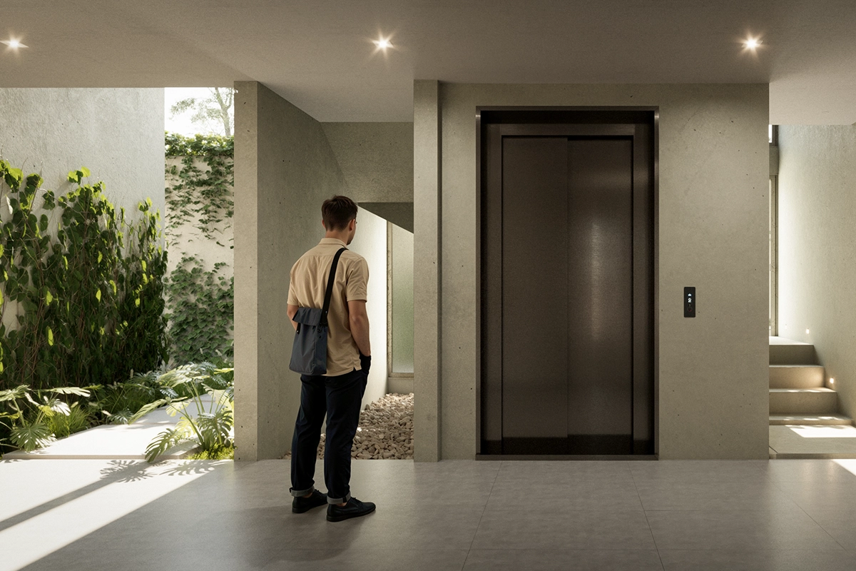 Area de lobby con elevador en cada edificio de Metrocity.