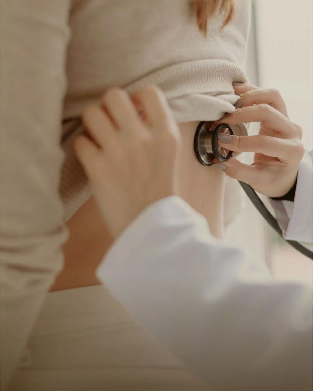 doctor checking a patient's heart