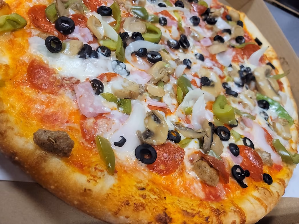 Everything topping pizza