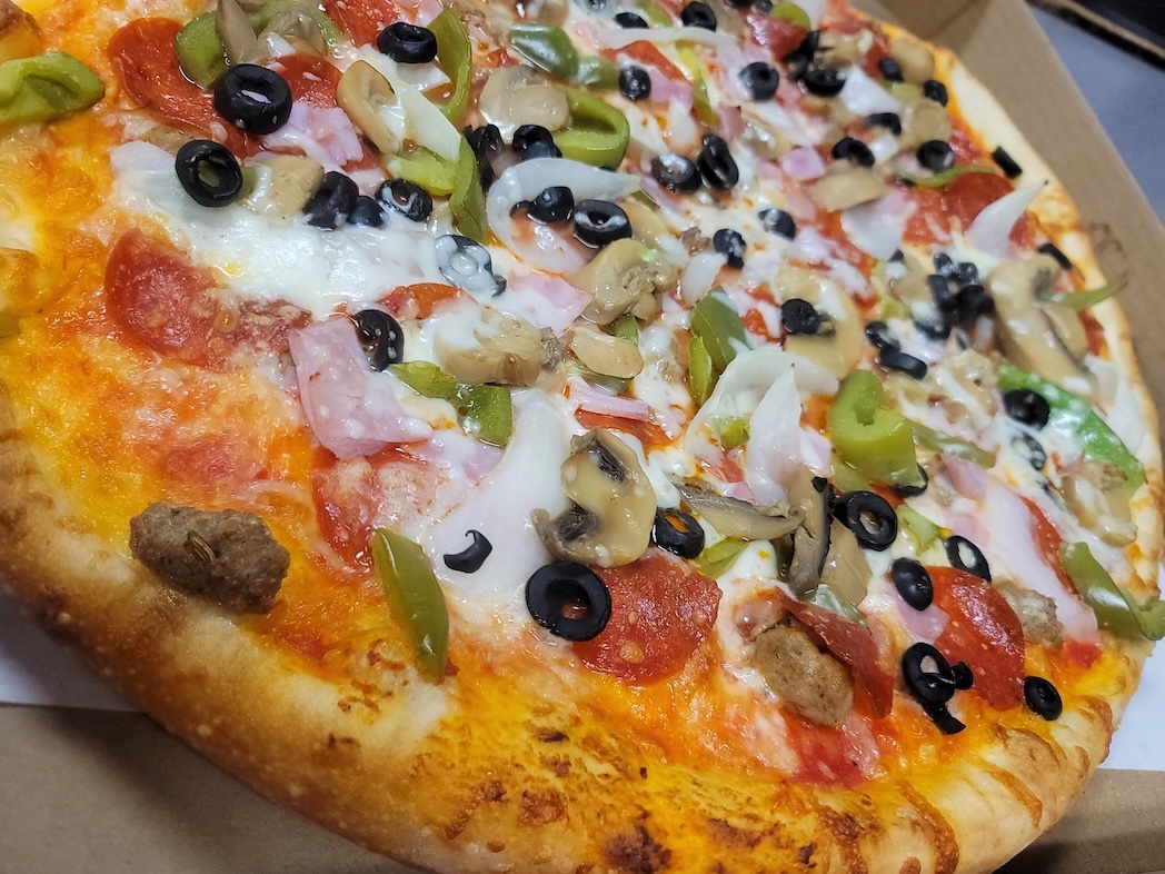 Everything topping pizza