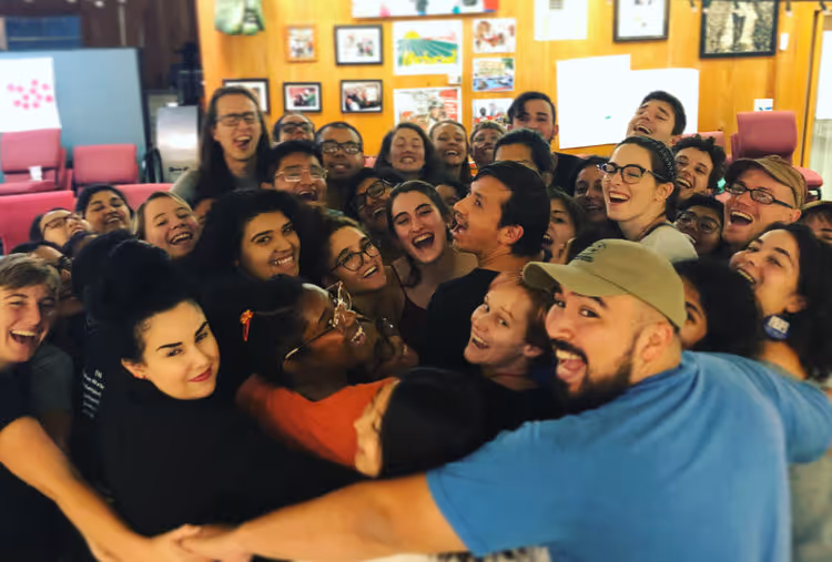 group image of organizers huddled in a group