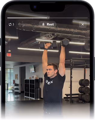 Phone with a screenshot of a video of Timothy Rainer working out