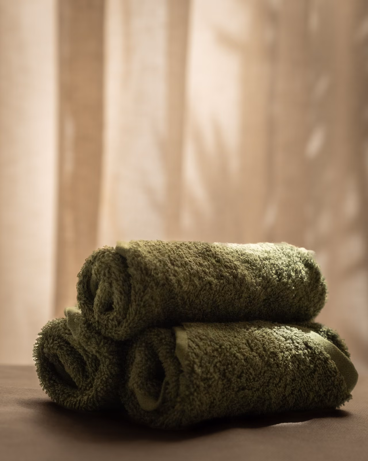 Savia towels in soft light, associated with rest and relaxation.