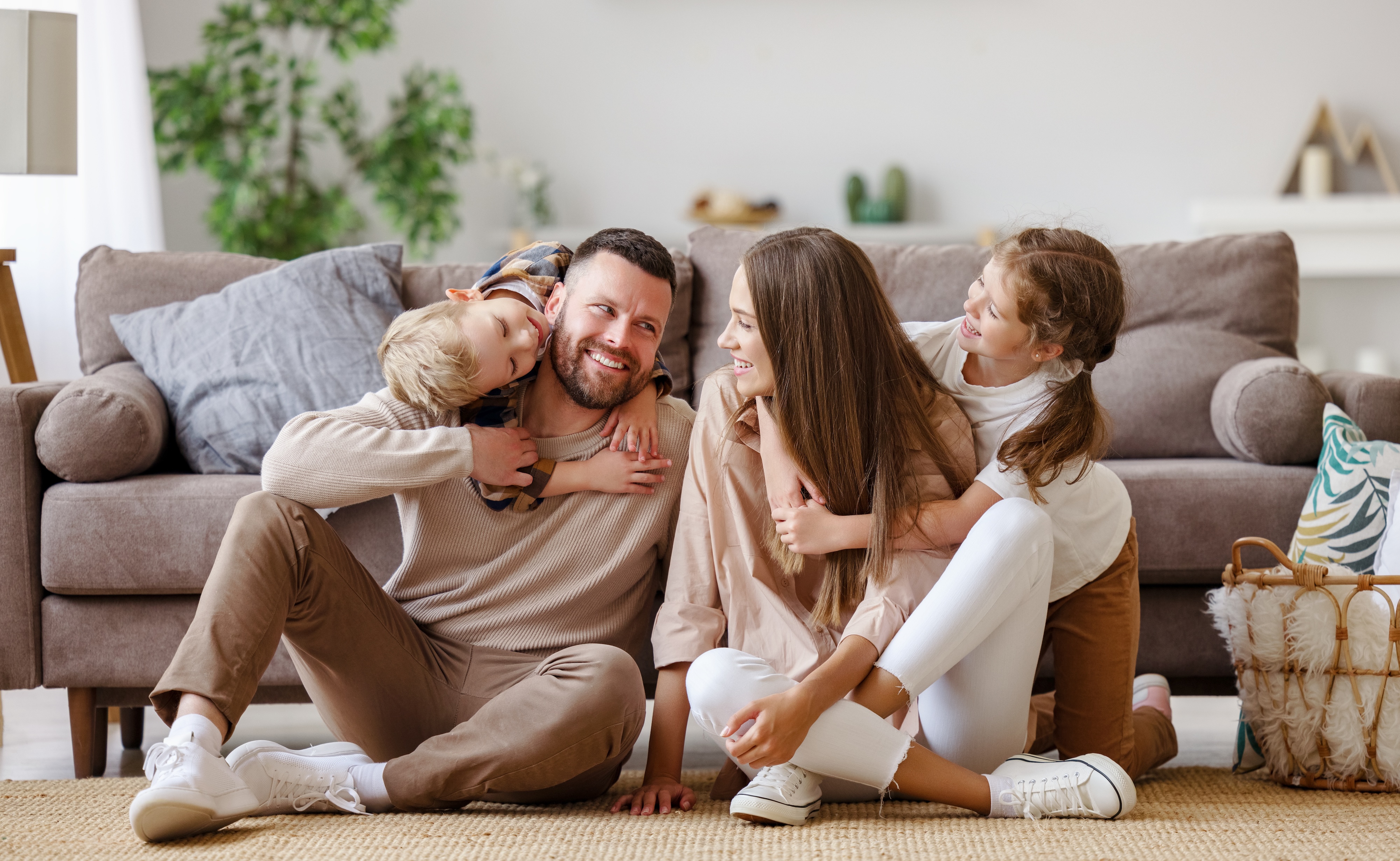 Family sitting in living room stock image