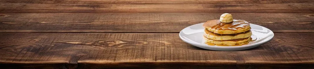 Horizontal image of pancakes sitting on a table