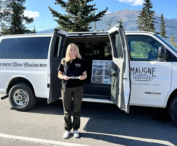 Maligne Rafting staff member at the white check-in van in Jasper