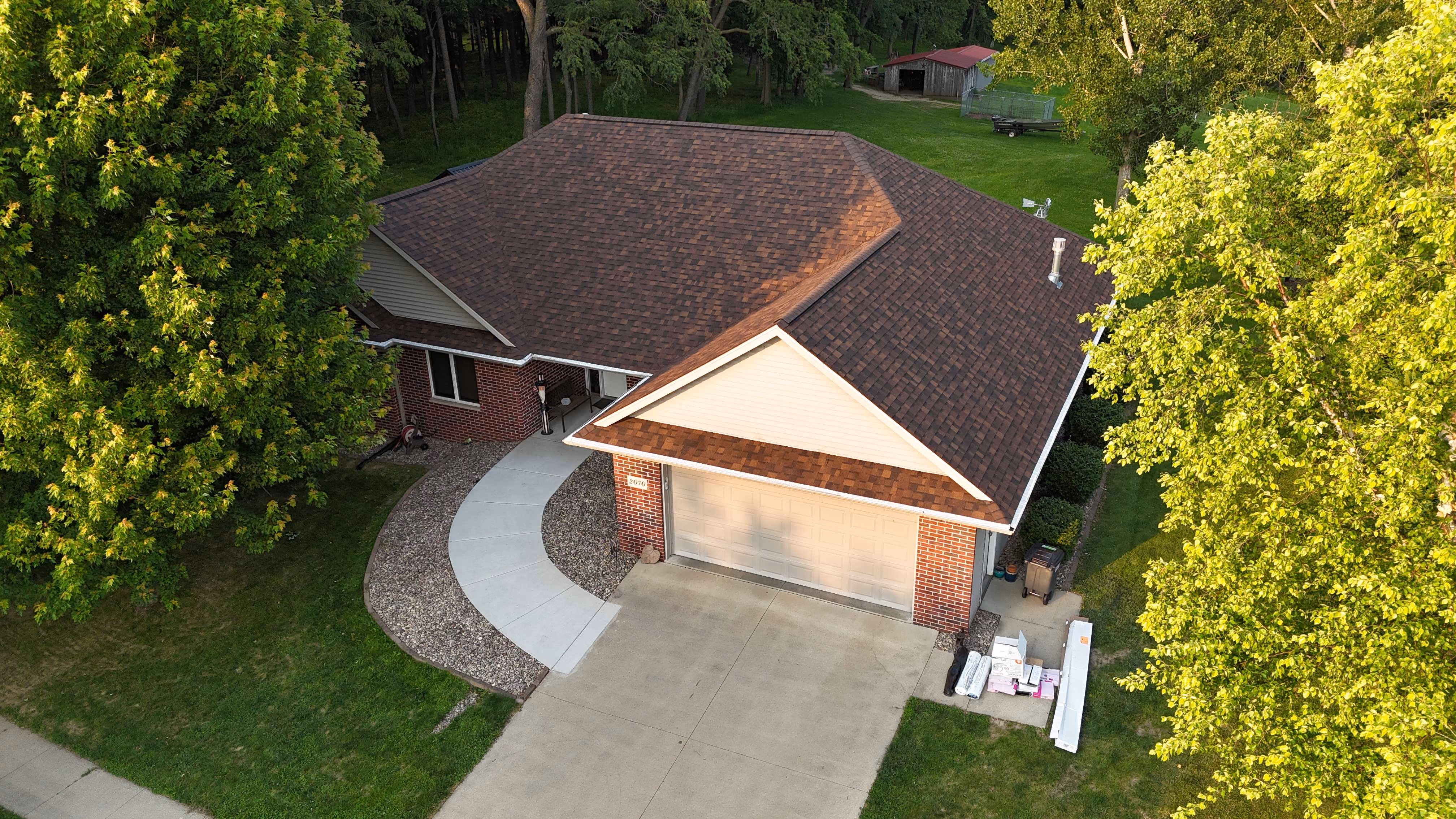 Aerial view of a completed roofing project by Passion Exteriors in Eastern Iowa
