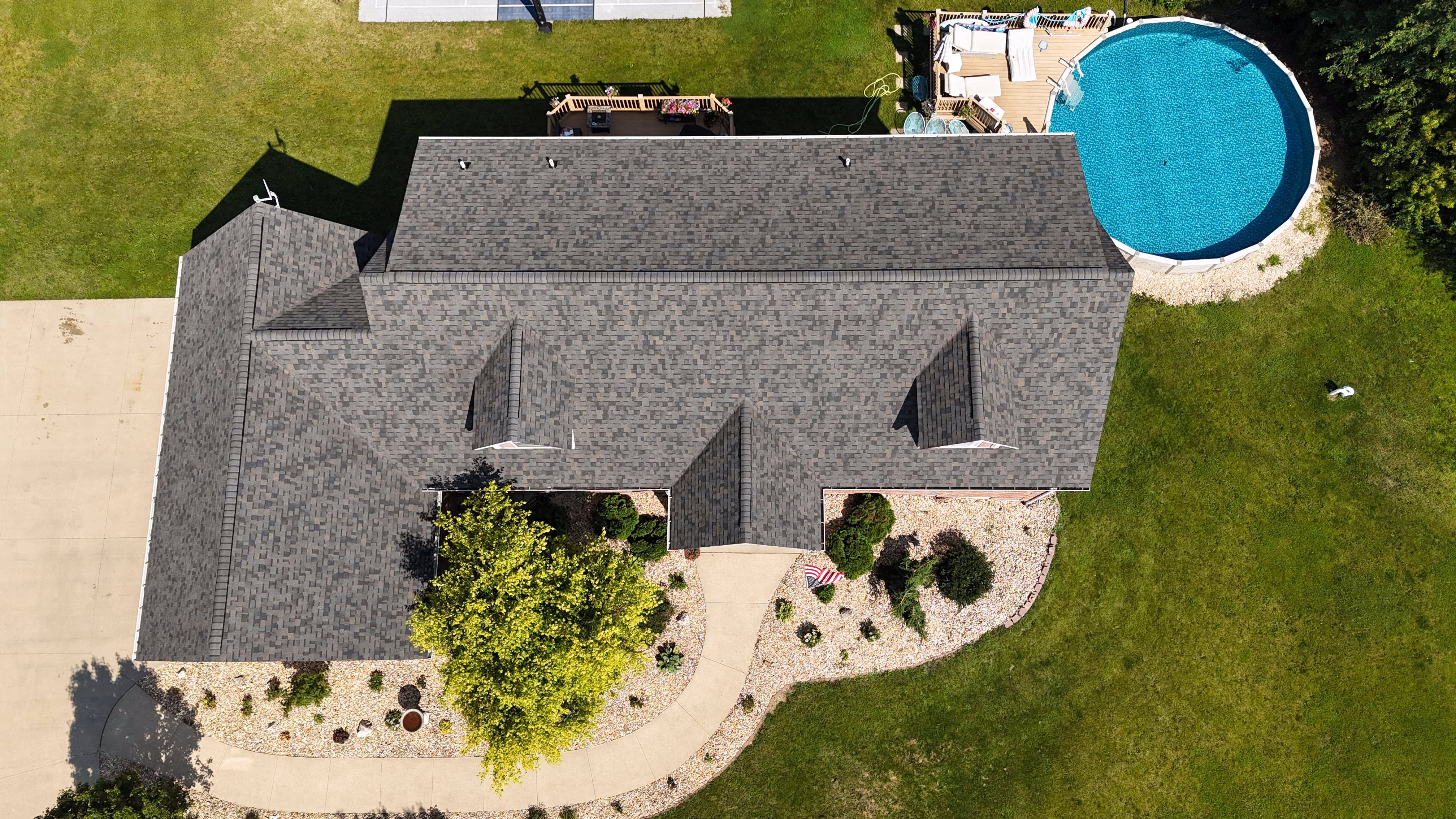 Aerial view of a completed roofing project by Passion Exteriors in Eastern Iowa