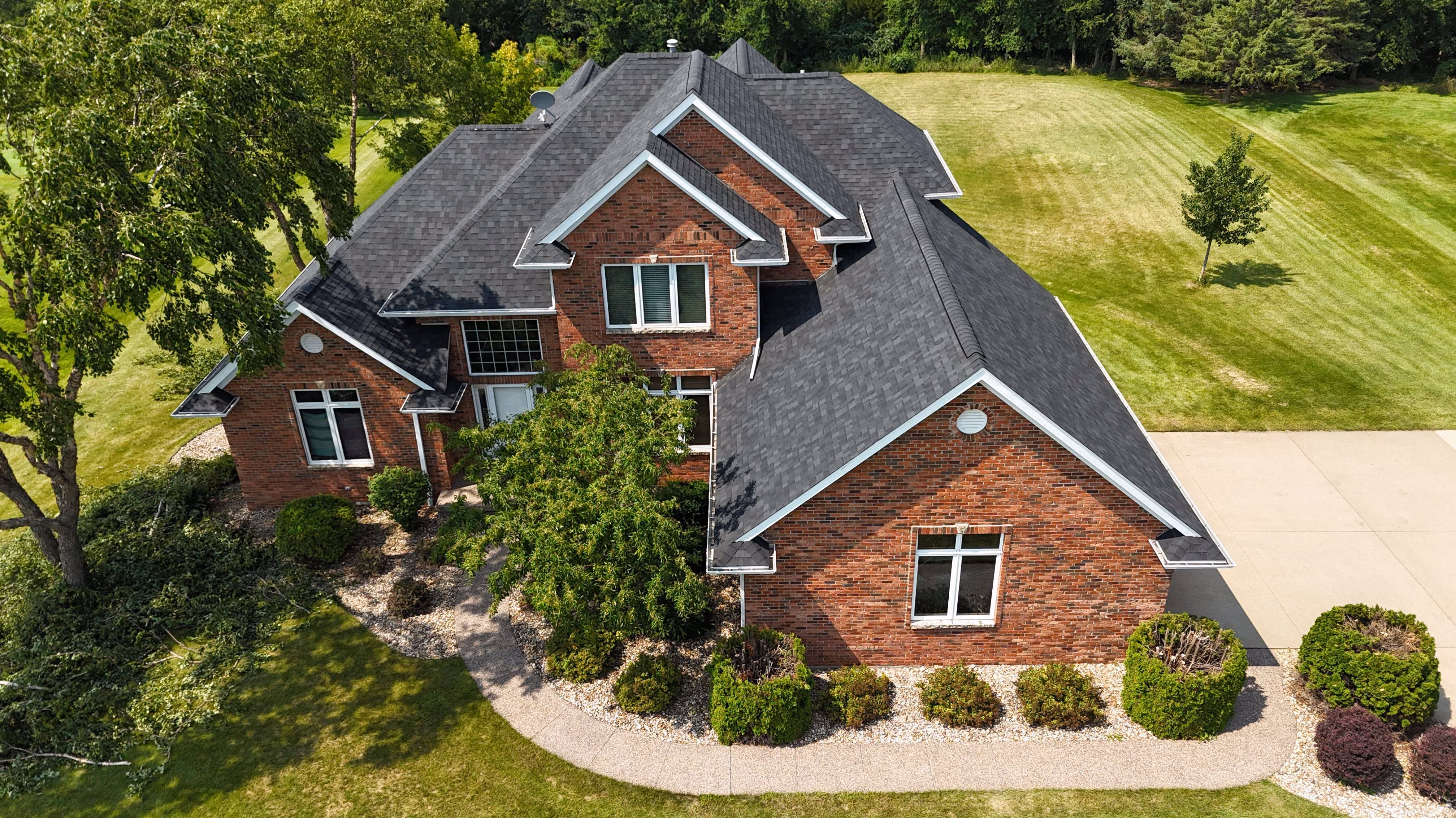 Aerial view of a completed roofing project by Passion Exteriors in Eastern Iowa