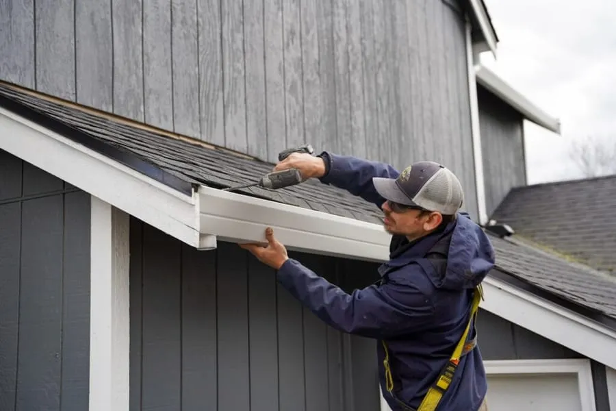 Seamless gutter and fascia installation on a home