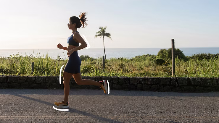 Woman running by the ocean