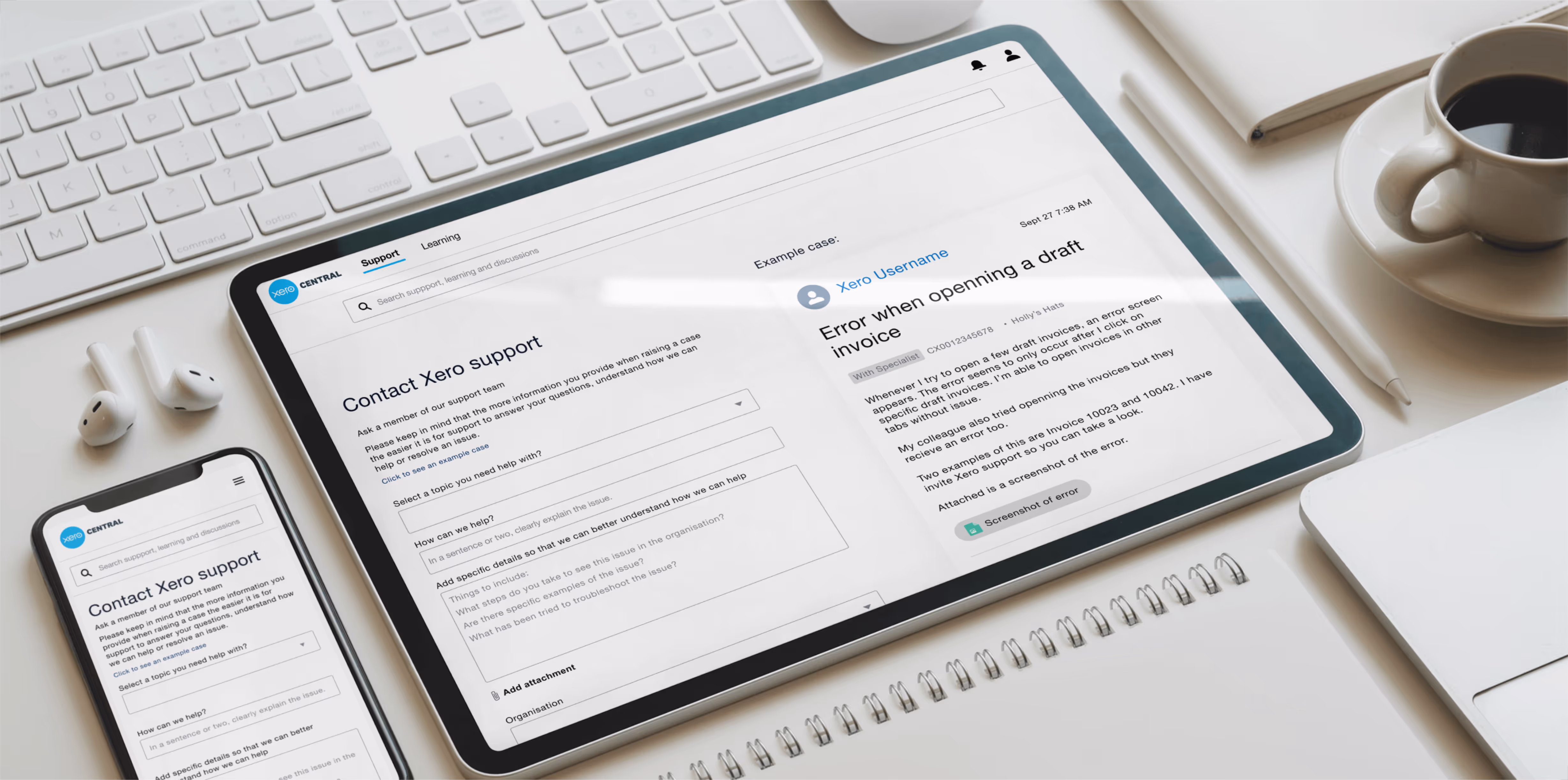 Tablet and smartphone displaying Xero support contact forms on a workspace desk with a keyboard, coffee cup, notebook, and pen.