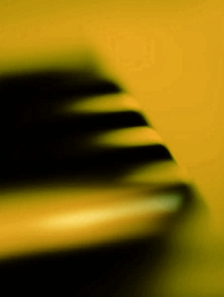 Abstract close-up of a blue and black gradient with soft horizontal streaks on a blue background.