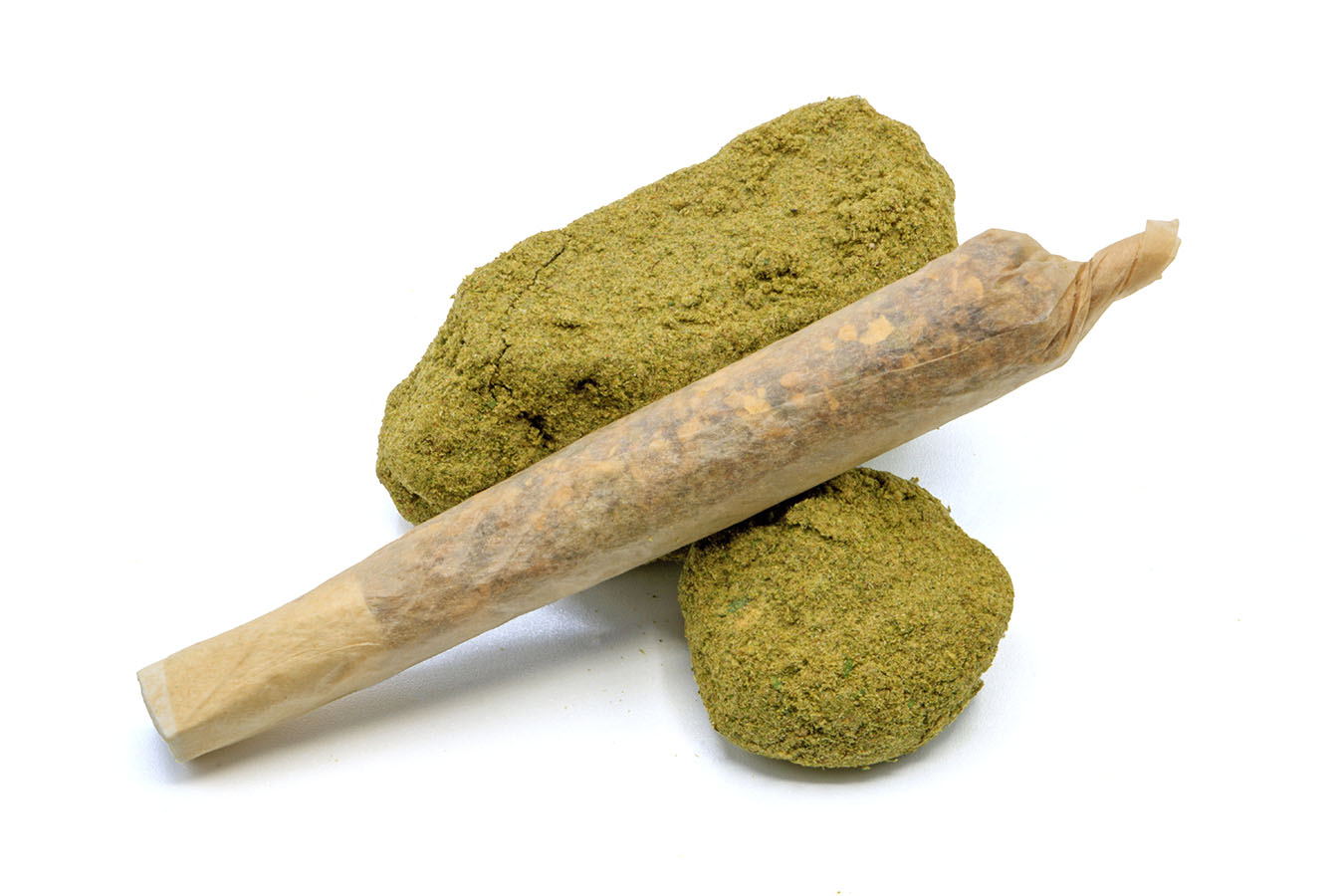 Infused pre-roll leaning on top of two Moon Rocks