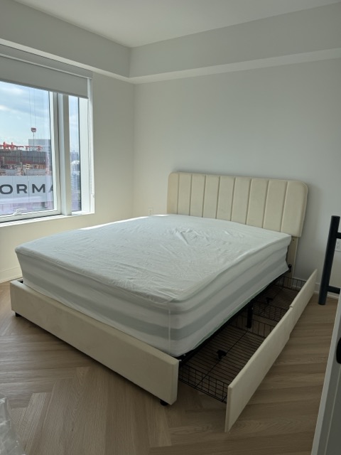 Cream Upholstered Storage Bed Assembly