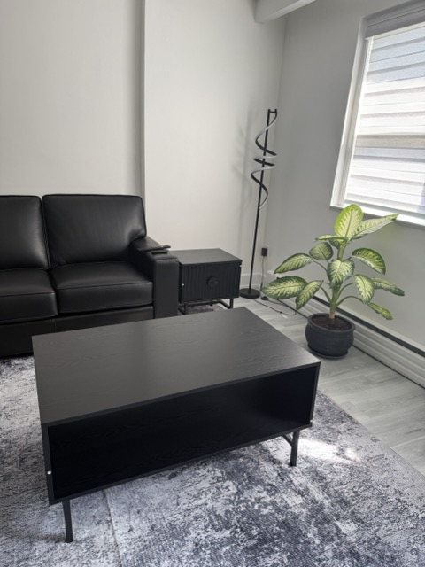 Black Leather Sofa and Coffee Table Assembly