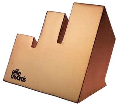 Bronze Effie Awards trophy shaped with three ascending vertical bars and the Effie Awards logo.
