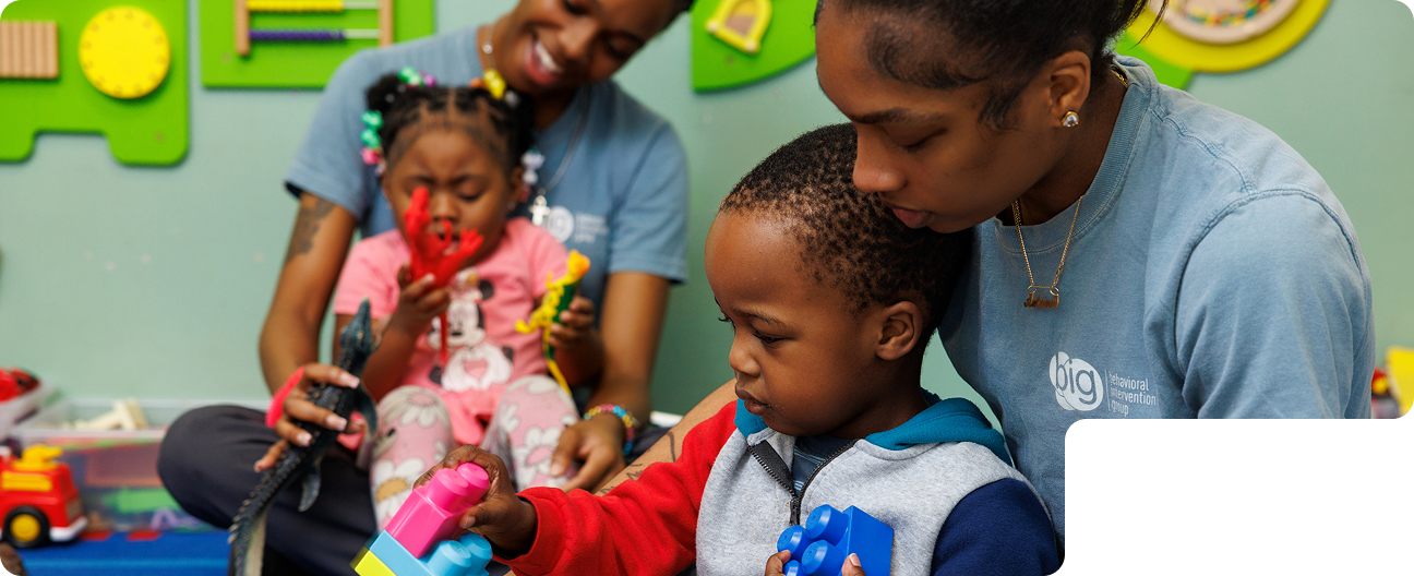 BIG staff playing blocks with a child