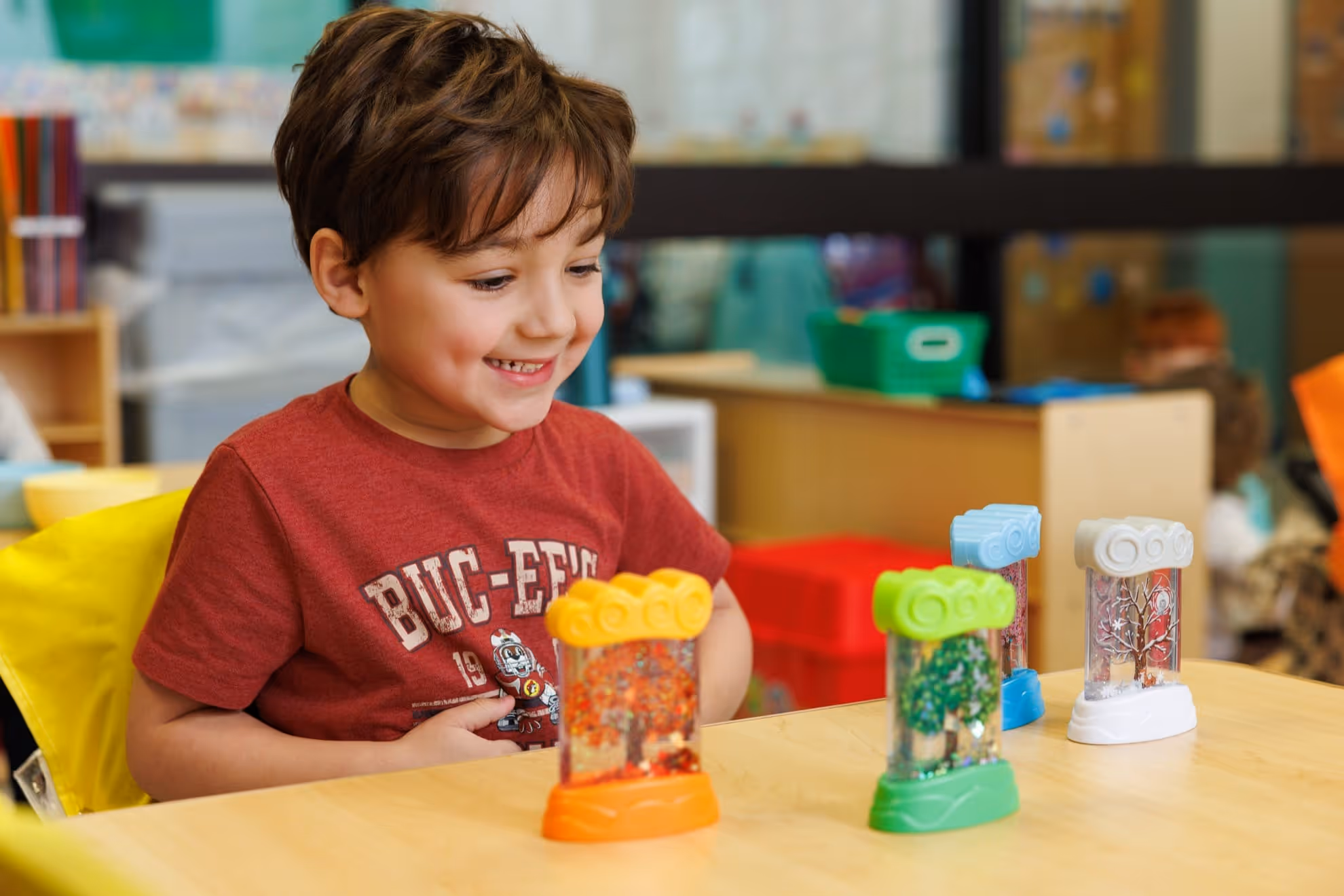 Child looking at learning toys on a table