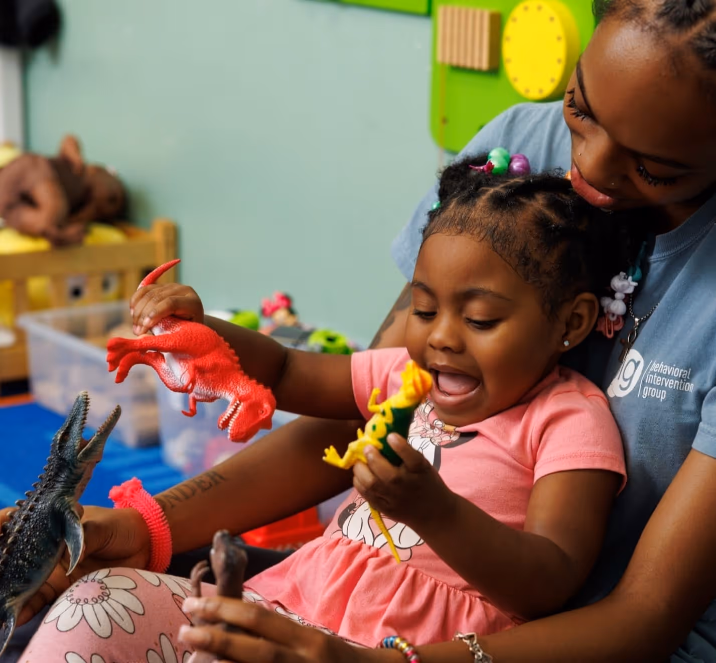 BIG staff member playing with child